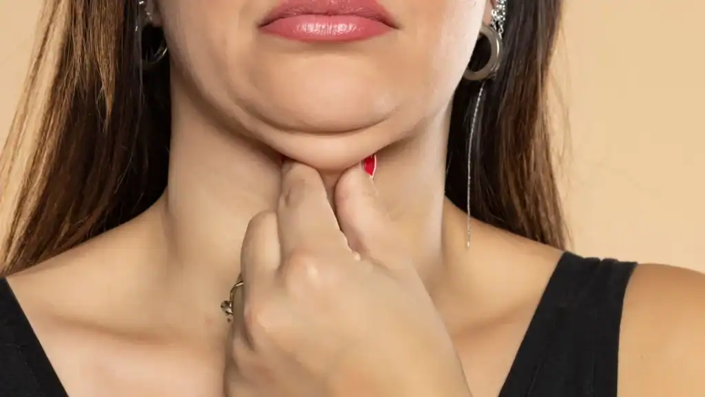 An image of a woman with double chin, sad, worried : Non Surgical Double Chin Removal Treatment in Sunbury, UK
